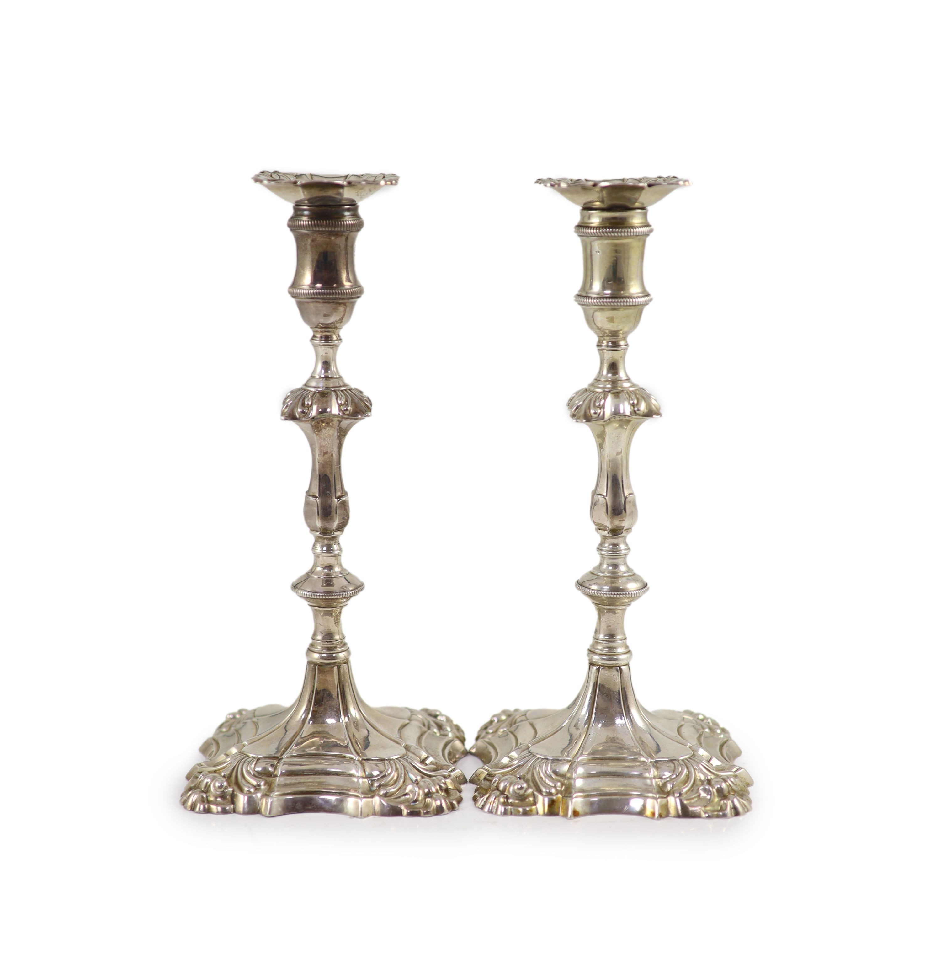 A pair of early George III cast silver candlesticks by William Cafe